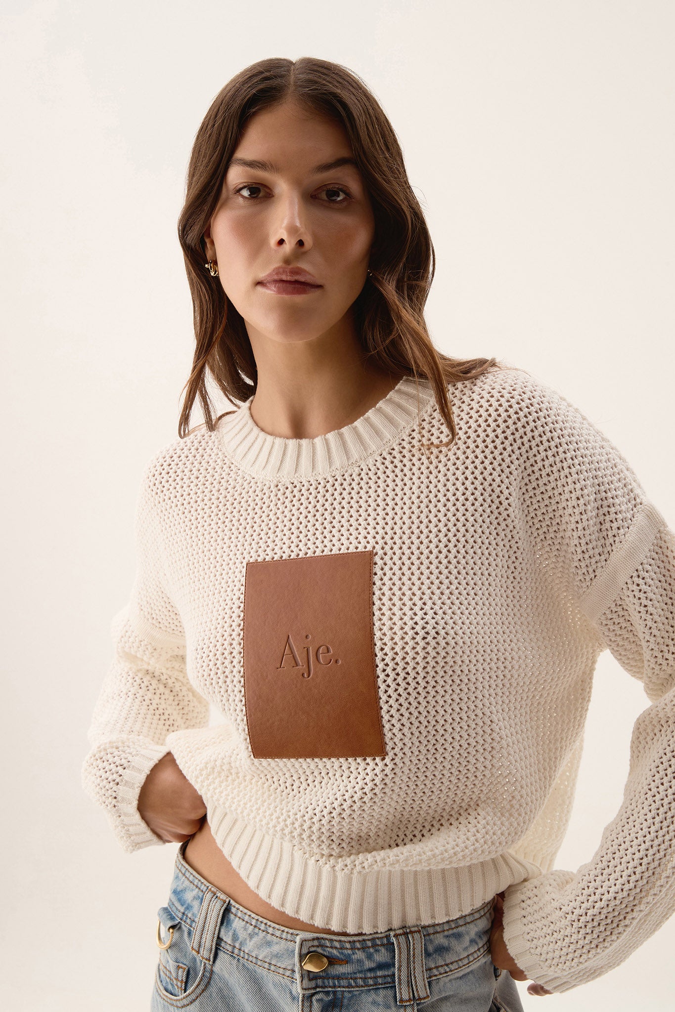 Prima Logo Knit Jumper Ivory Aje – Aje AU - Main Image